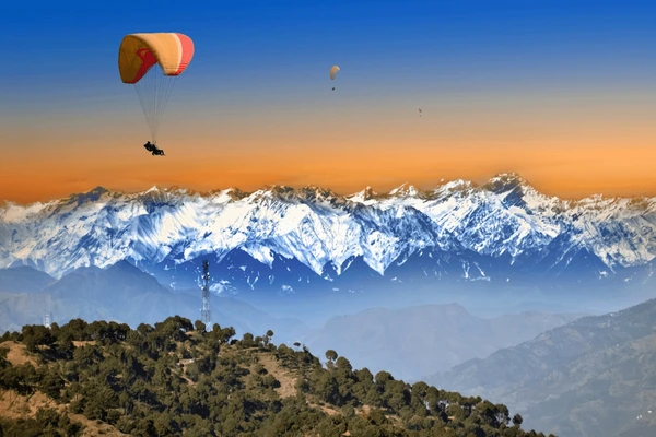 paragliding over clouds sunset view 600nw 2456364047